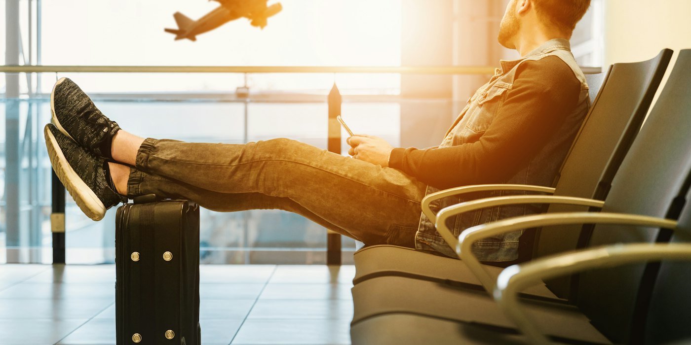 Traveller waiting at an airport gate